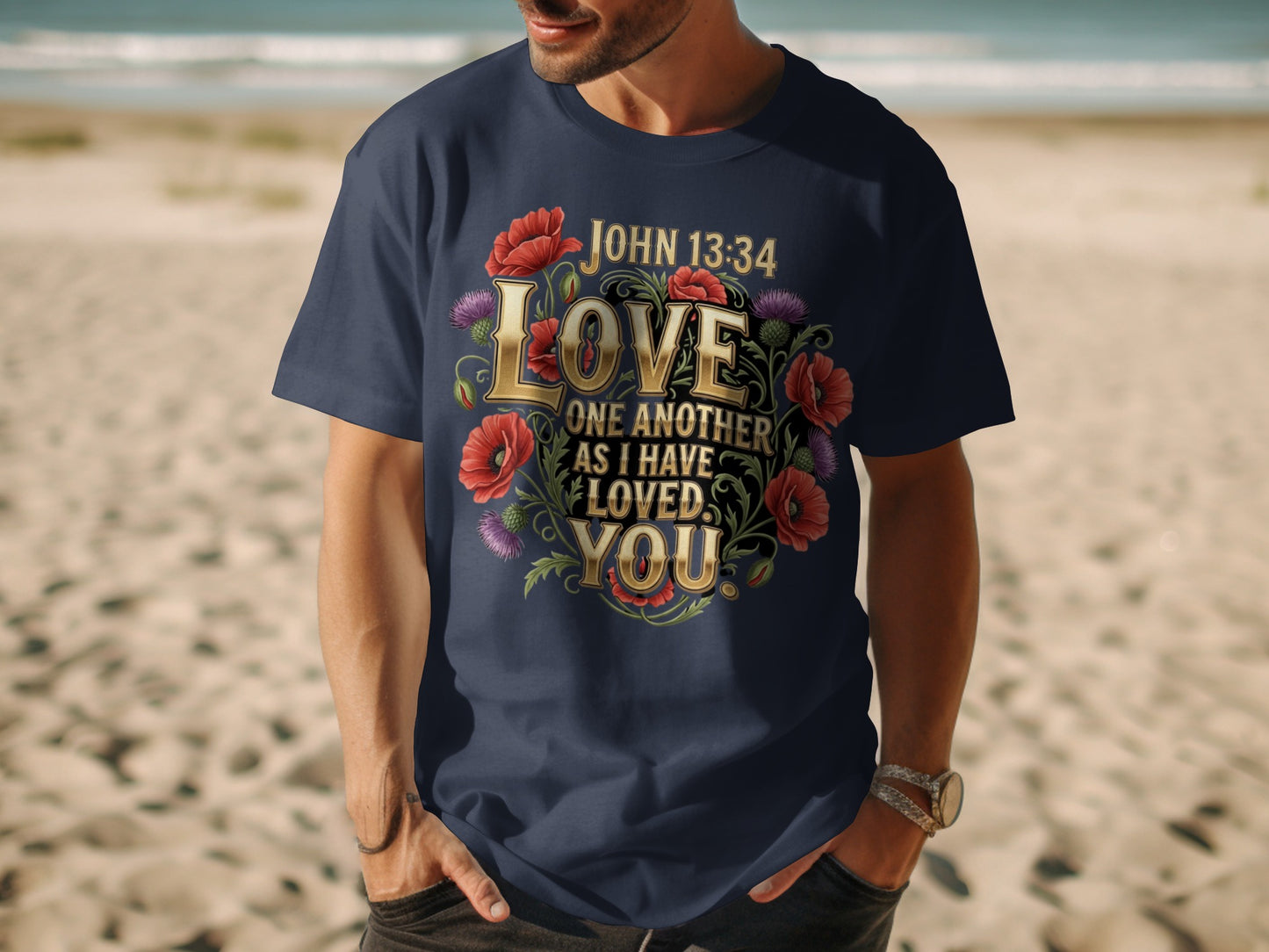 Dark blue t-shirt with gold text "Love One Another As I Have Loved You" and flowers.