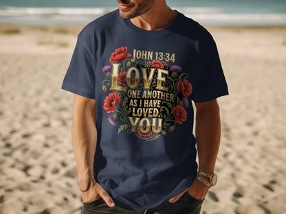 Dark blue t-shirt with gold text "Love One Another As I Have Loved You" and flowers.