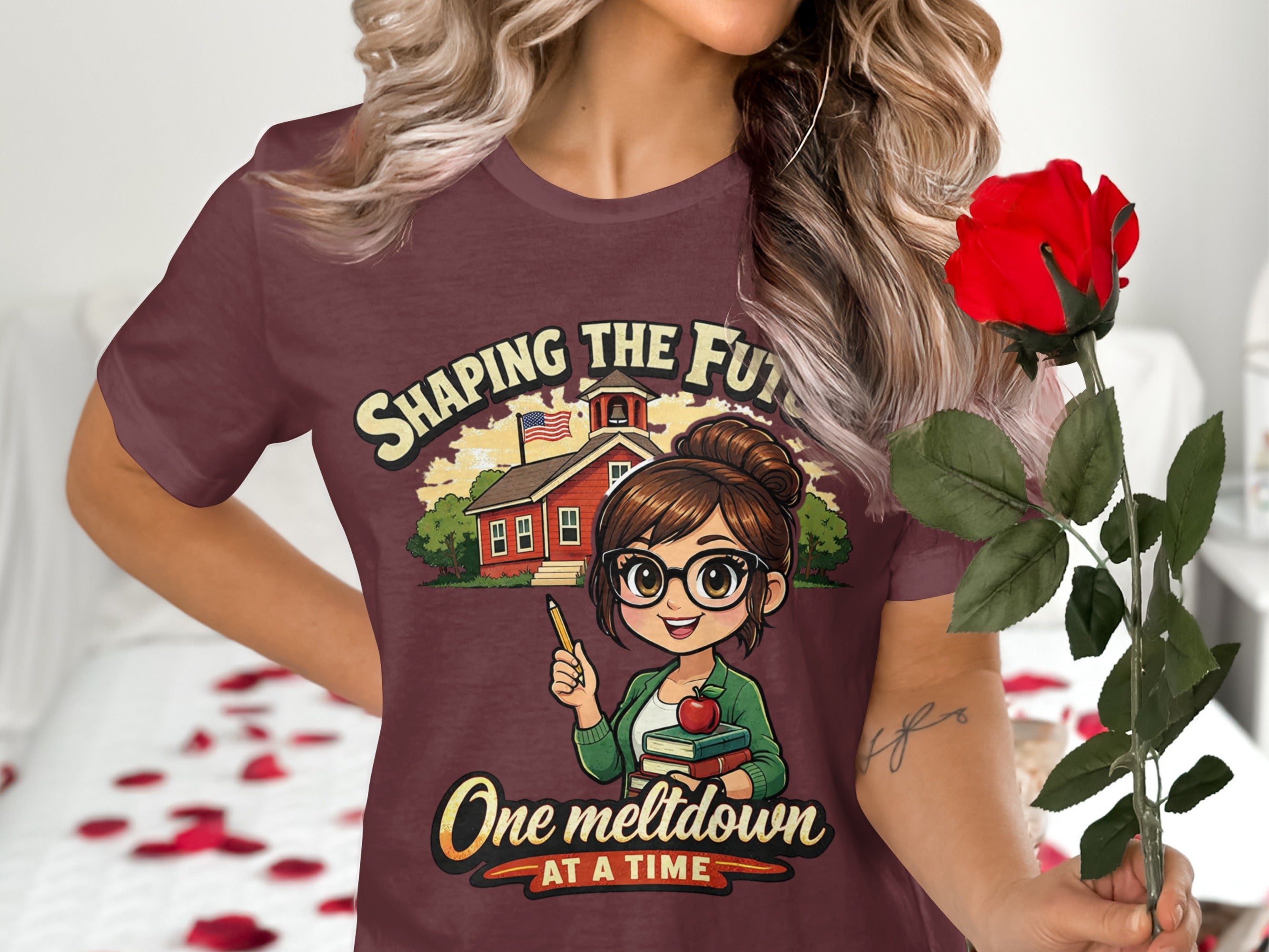Maroon t-shirt with cartoon teacher and school, text "Shaping the Future, One Meltdown At A Time."