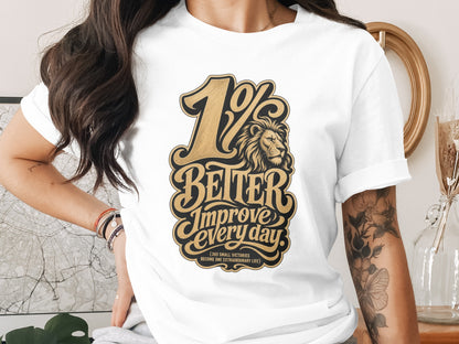 White t-shirt with "1% Better" design featuring a lion and motivational text.