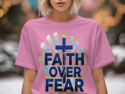 Pink t-shirt with a blue cross and text "FAITH OVER FEAR".