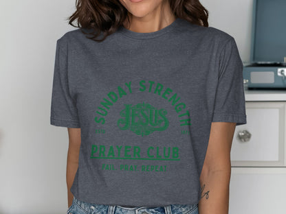 Dark grey t-shirt with green text "Sunday Strength Jesus Prayer Club Fail, Pray, Repeat".