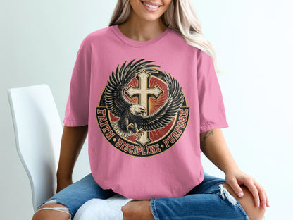 Pink t-shirt with eagle, cross, and text reading "FAITH DISCIPLINE PURPOSE".