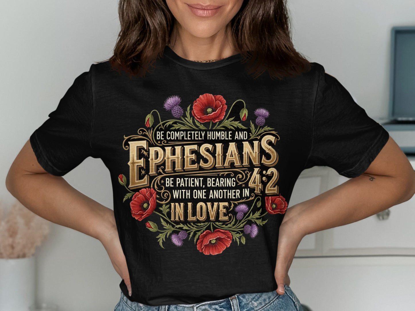 Black t-shirt with Ephesians 4:2 text and poppy and thistle floral design.