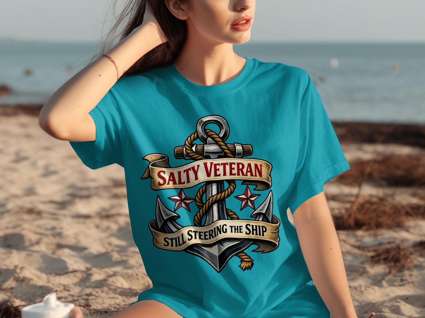 Turquoise t-shirt with anchor graphic and text "SALTY VETERAN STILL STEERING THE SHIP".