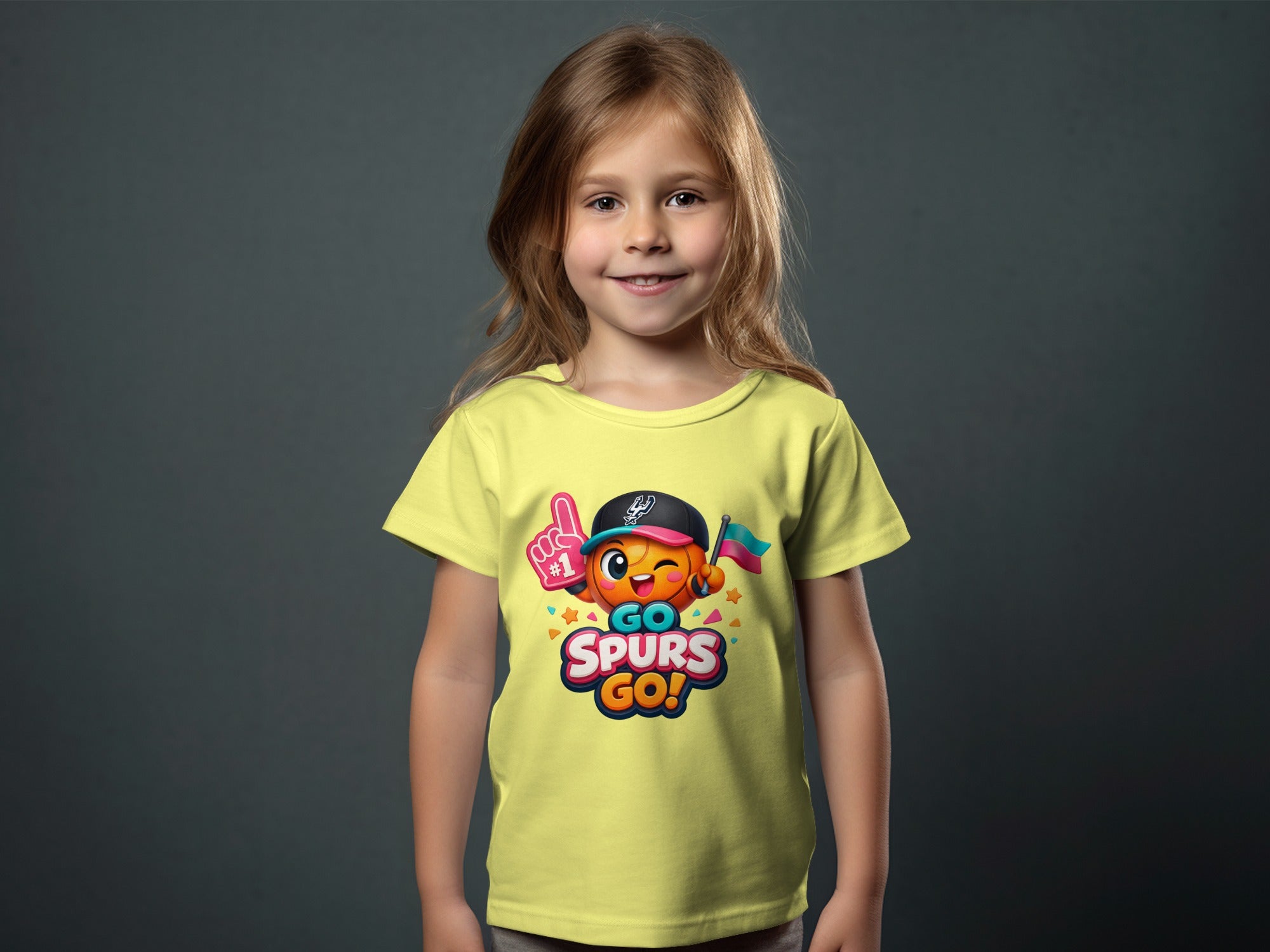 Child wearing yellow t-shirt with "GO SPURS GO!" text and cartoon graphic.