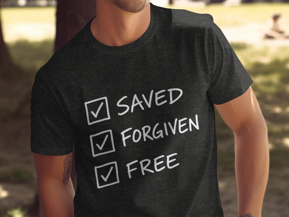 Dark t-shirt with white text checklist: Saved, Forgiven, Free.