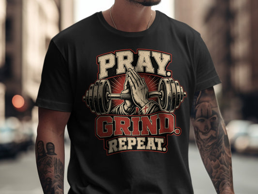 Black t-shirt with Pray. Grind. Repeat. text and praying hands between dumbbells.