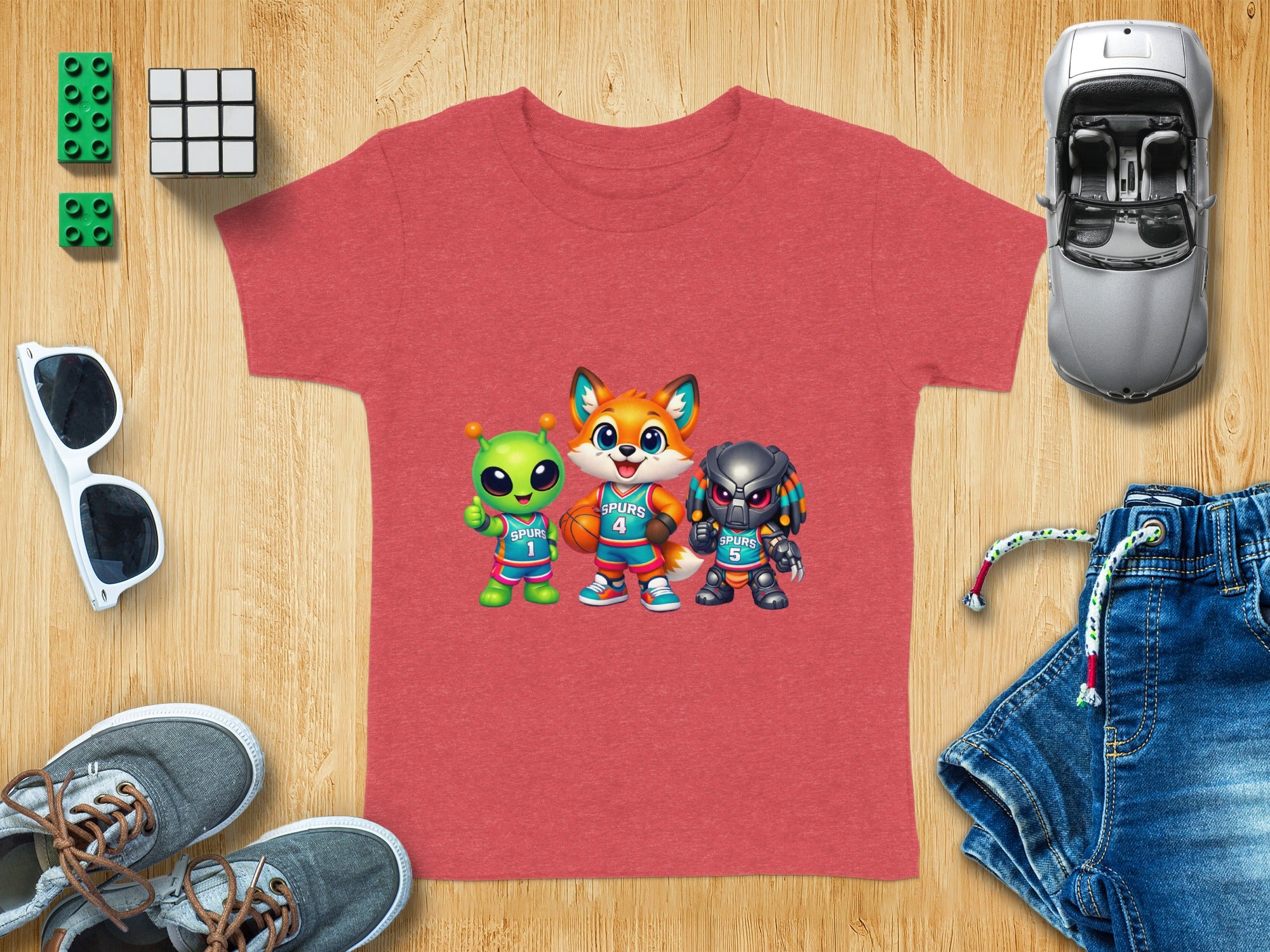 Red t-shirt with cartoon characters dressed as basketball players: alien, fox, and predator.