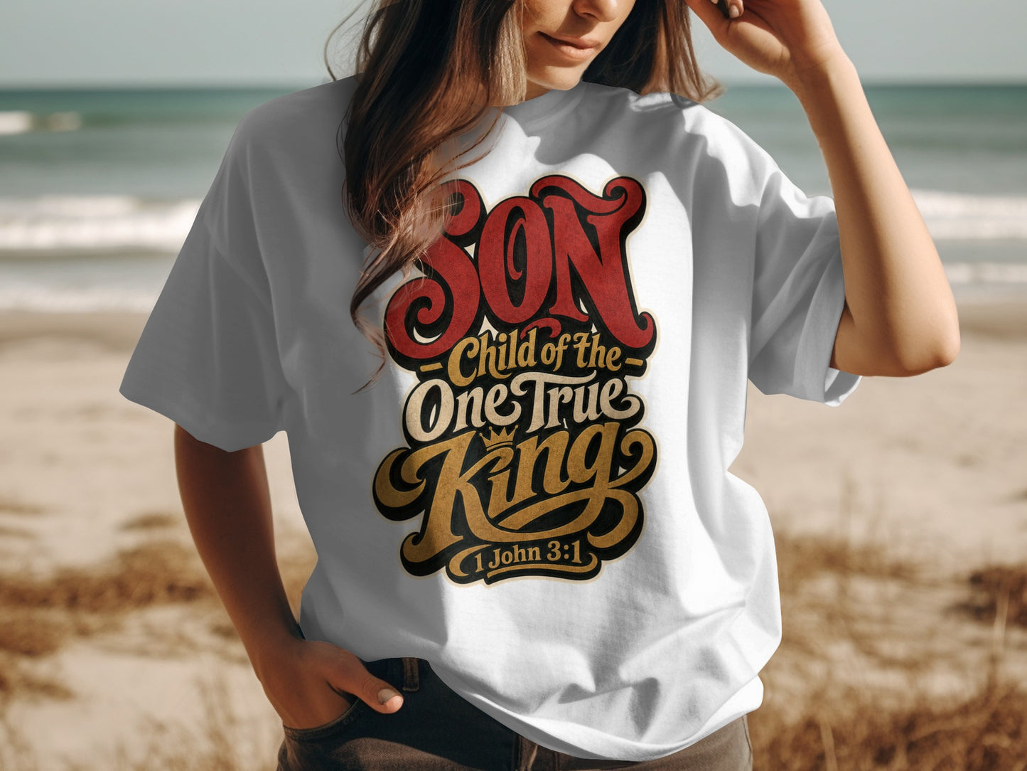 White t-shirt with text "SON Child of the One True King 1 John 3:1".