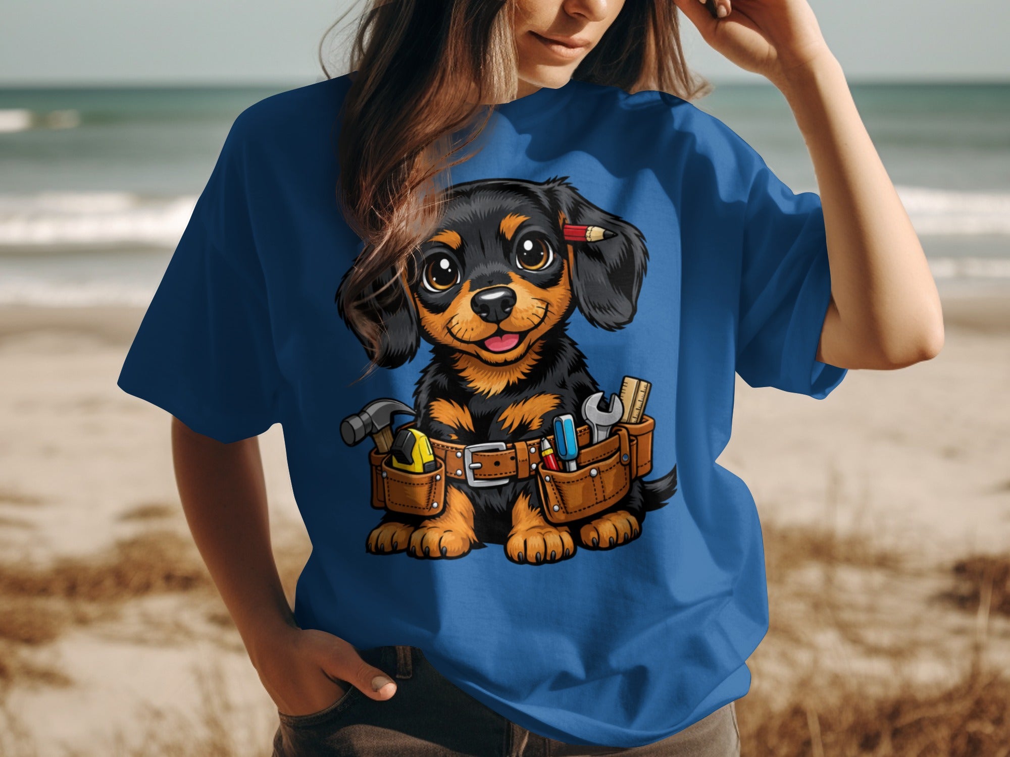 Dachshund puppy wearing a tool belt and a pencil behind its ear.