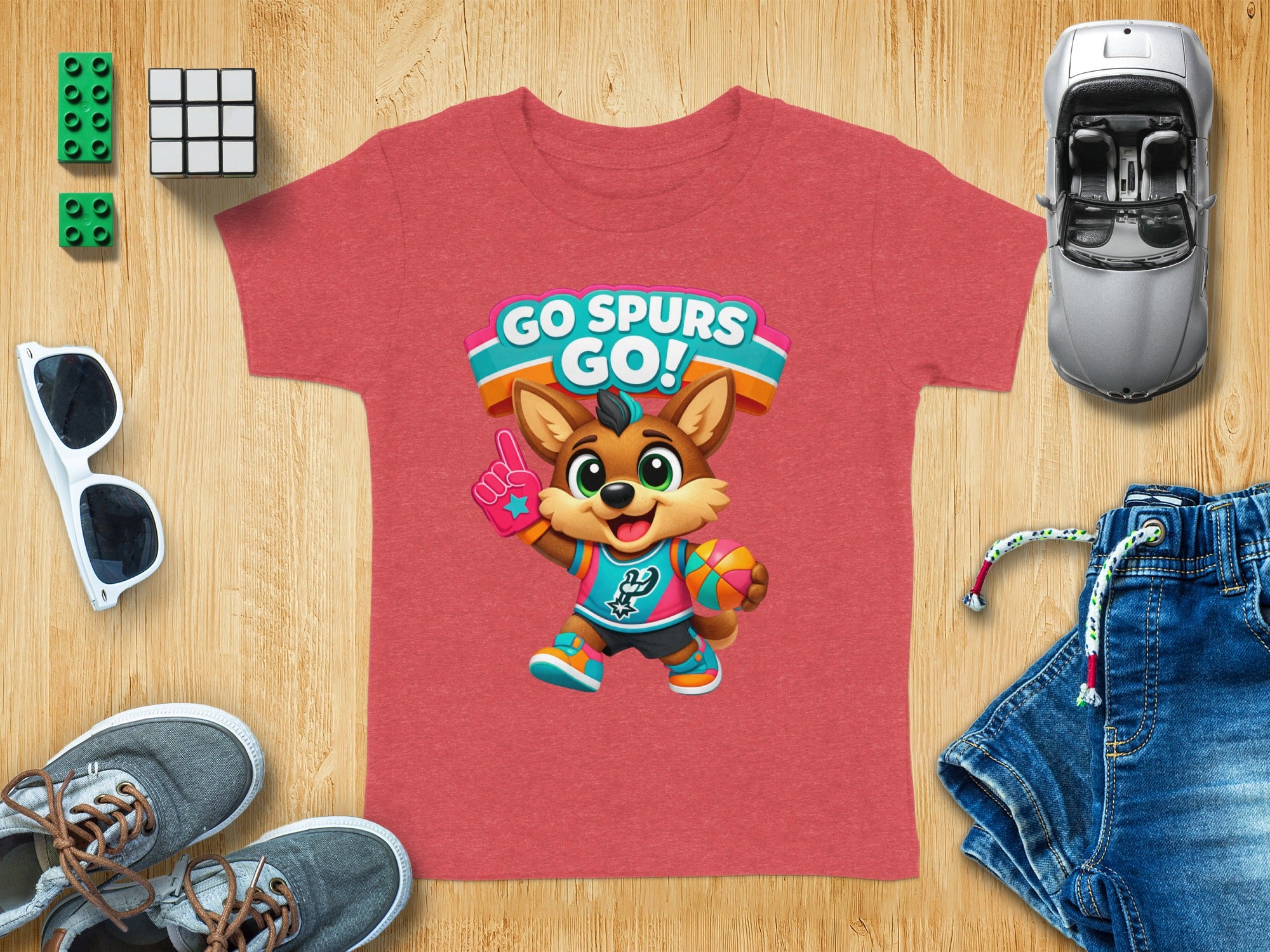 Kid's red t-shirt with cartoon mascot and "Go Spurs Go!" text.