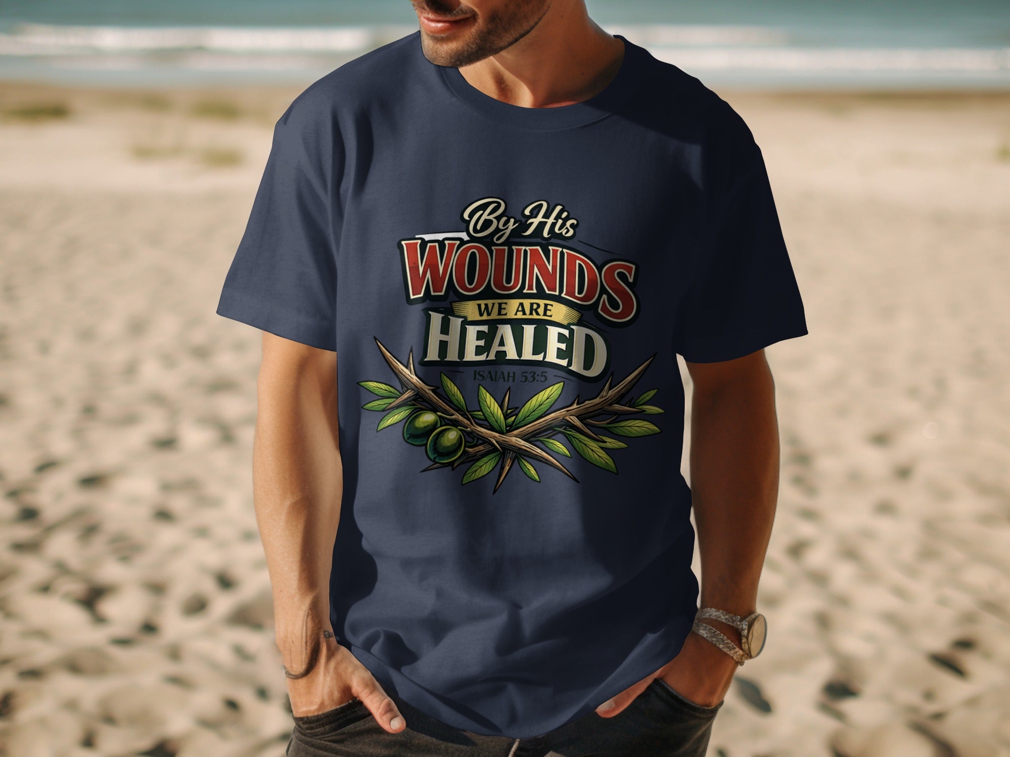 Dark blue t-shirt with "By His Wounds We Are Healed Isaiah 53:5" text and olive branches.
