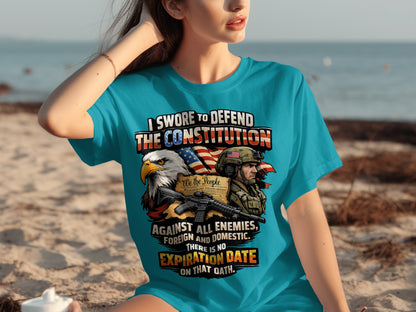 Graphic tee with eagle, soldier, rifle, and text about defending the Constitution.