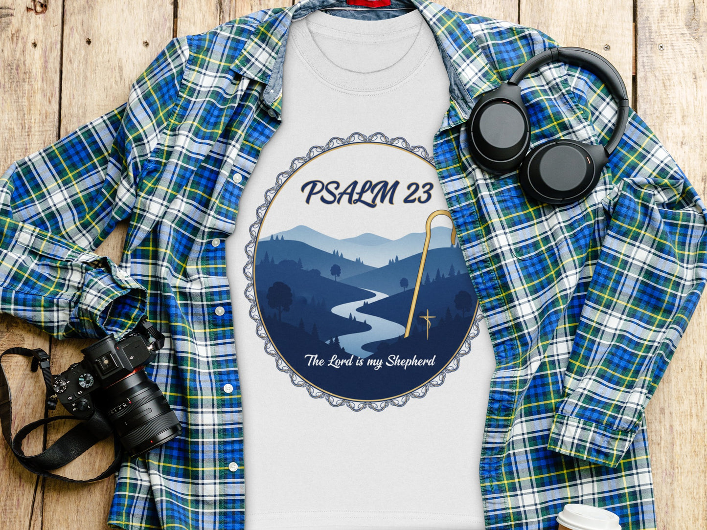 White t-shirt with Psalm 23 design featuring a landscape and the text "The Lord is my Shepherd."