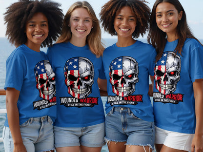 Four women wear blue t-shirts featuring a patriotic skull graphic and "Wounded Warrior Still in the Fight."