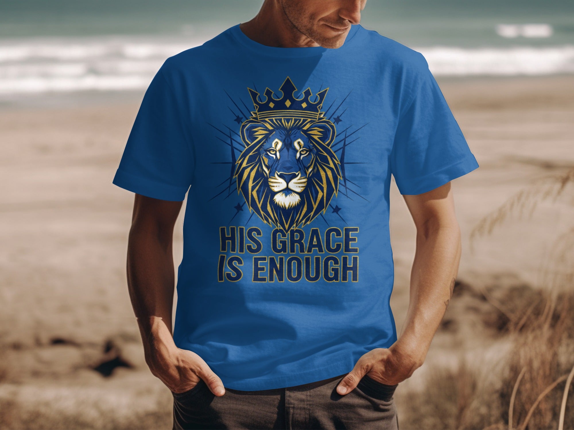 Blue t-shirt with lion wearing crown and text "HIS GRACE IS ENOUGH".