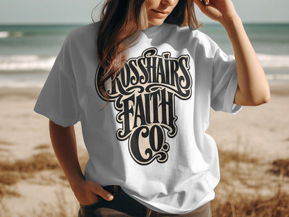 White t-shirt with "CROSSHAIRS FAITH CO" text in a decorative font.
