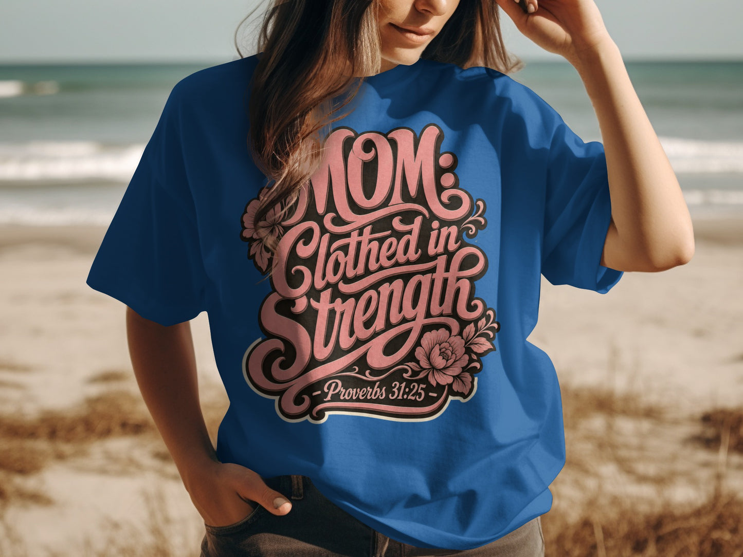 Blue t-shirt with "Mom: Clothed in Strength - Proverbs 31:25" text design.