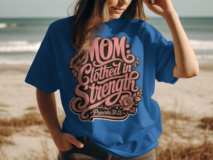 Blue t-shirt with "Mom: Clothed in Strength - Proverbs 31:25" text design.
