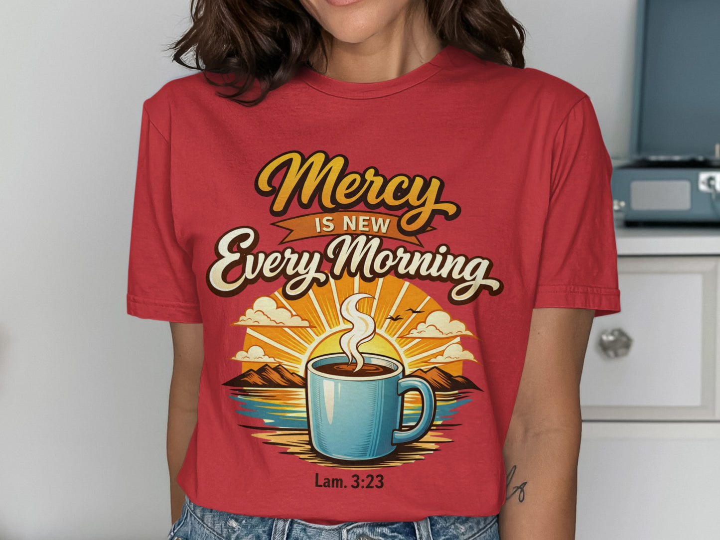 Red t-shirt with "Mercy Is New Every Morning" and "Lam. 3:23" text and coffee sunrise graphic.