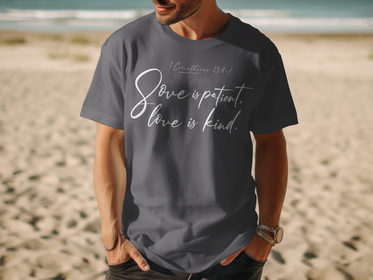 Dark grey t-shirt with white text "Love is patient, love is kind."