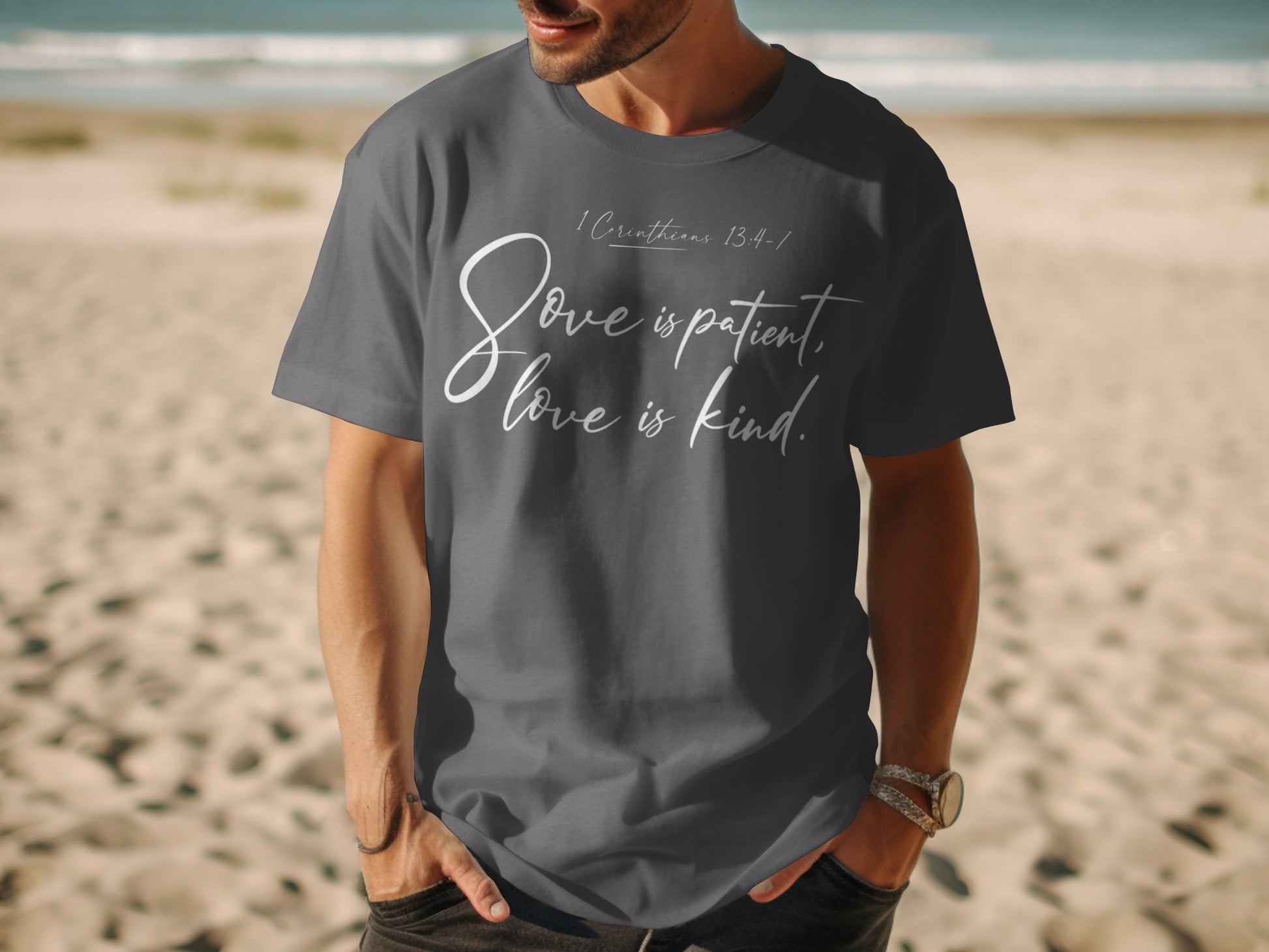 Dark grey t-shirt with white text "Love is patient, love is kind."