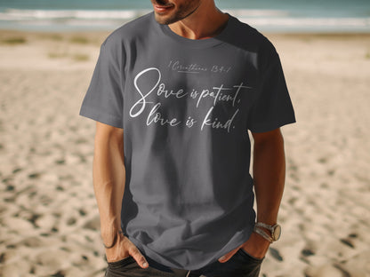 Dark grey t-shirt with white text "Love is patient, love is kind."
