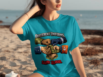 T-shirt with "Different Uniforms, Same Blood" graphic of diverse hands in military and naval uniforms.