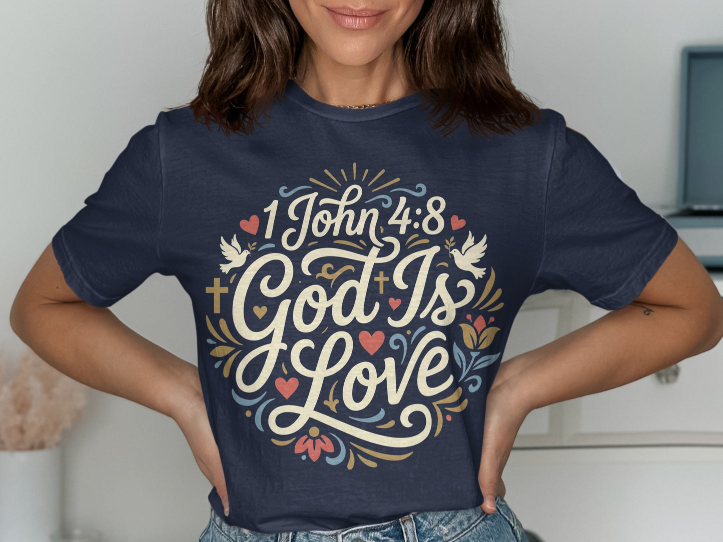 Navy t-shirt with "1 John 4:8 God Is Love" text and floral design.