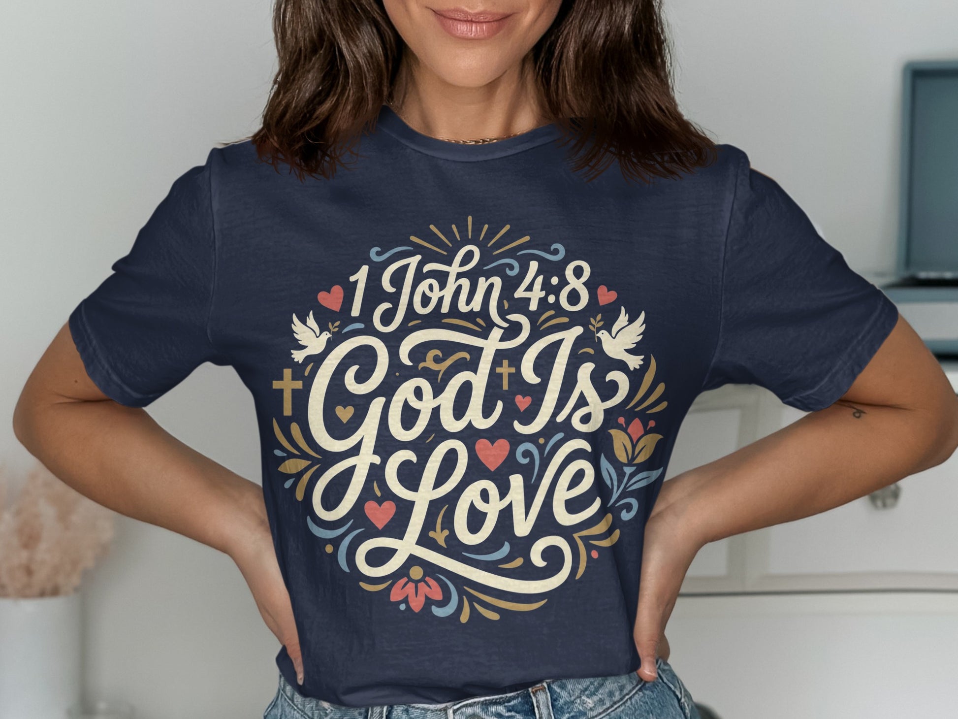 Navy t-shirt with "1 John 4:8 God Is Love" text and floral design.