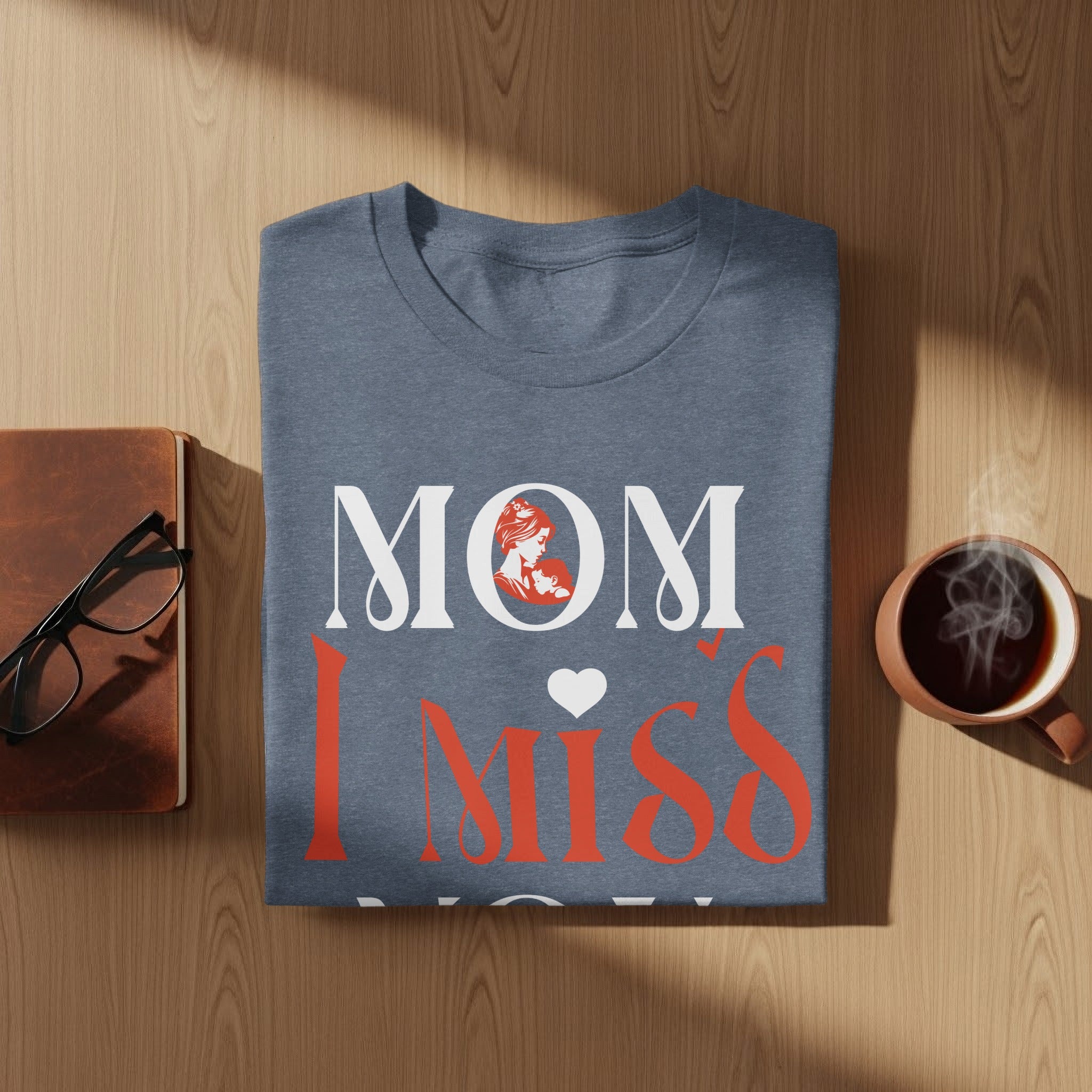 Grey t-shirt with text "Mom I Miss You" featuring a profile of a mother and child.