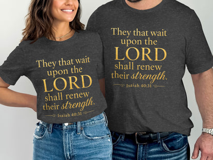 Two people wear dark t-shirts with gold text reading "They that wait upon the LORD shall renew their strength. Isaiah 40:31."