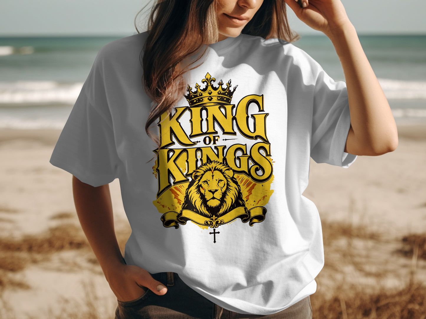 White t-shirt with "King of Kings" text, lion, crown, and cross design.