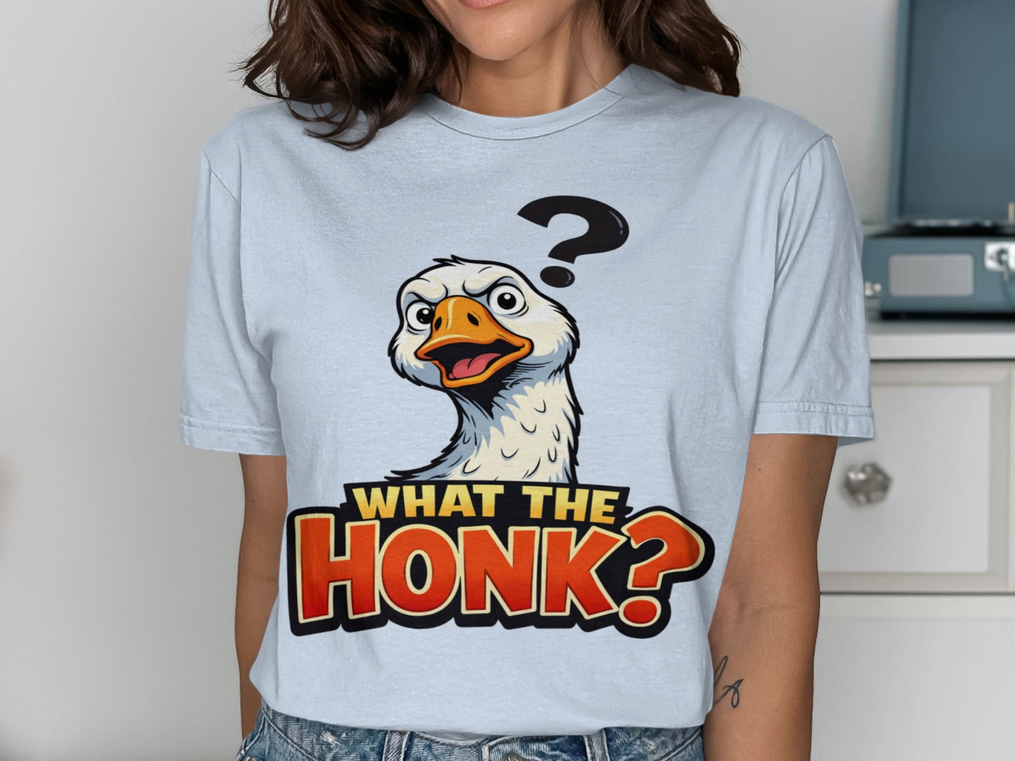 Light blue t-shirt with a startled goose and "What the Honk?" text.