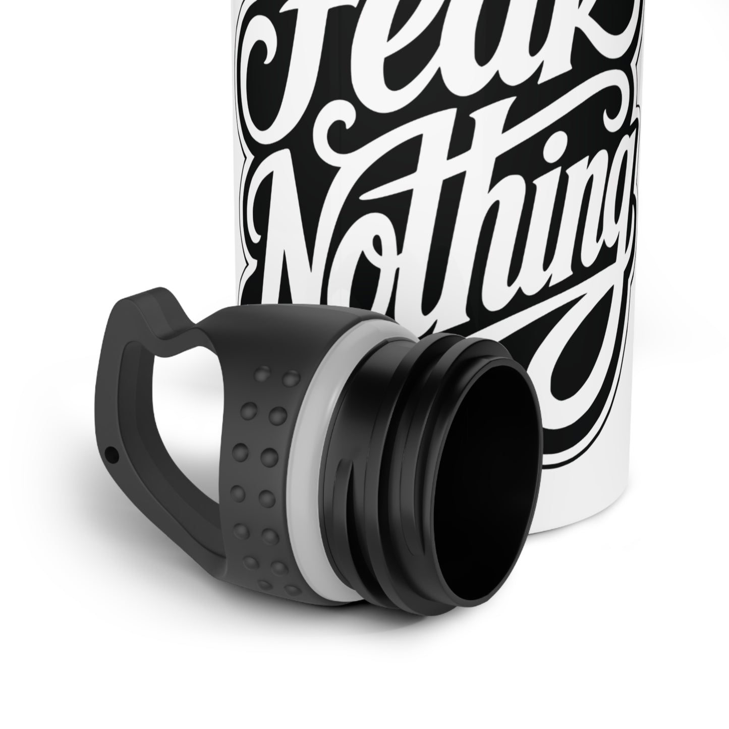 White bottle with black text "Fear Nothing" and a detached black lid.