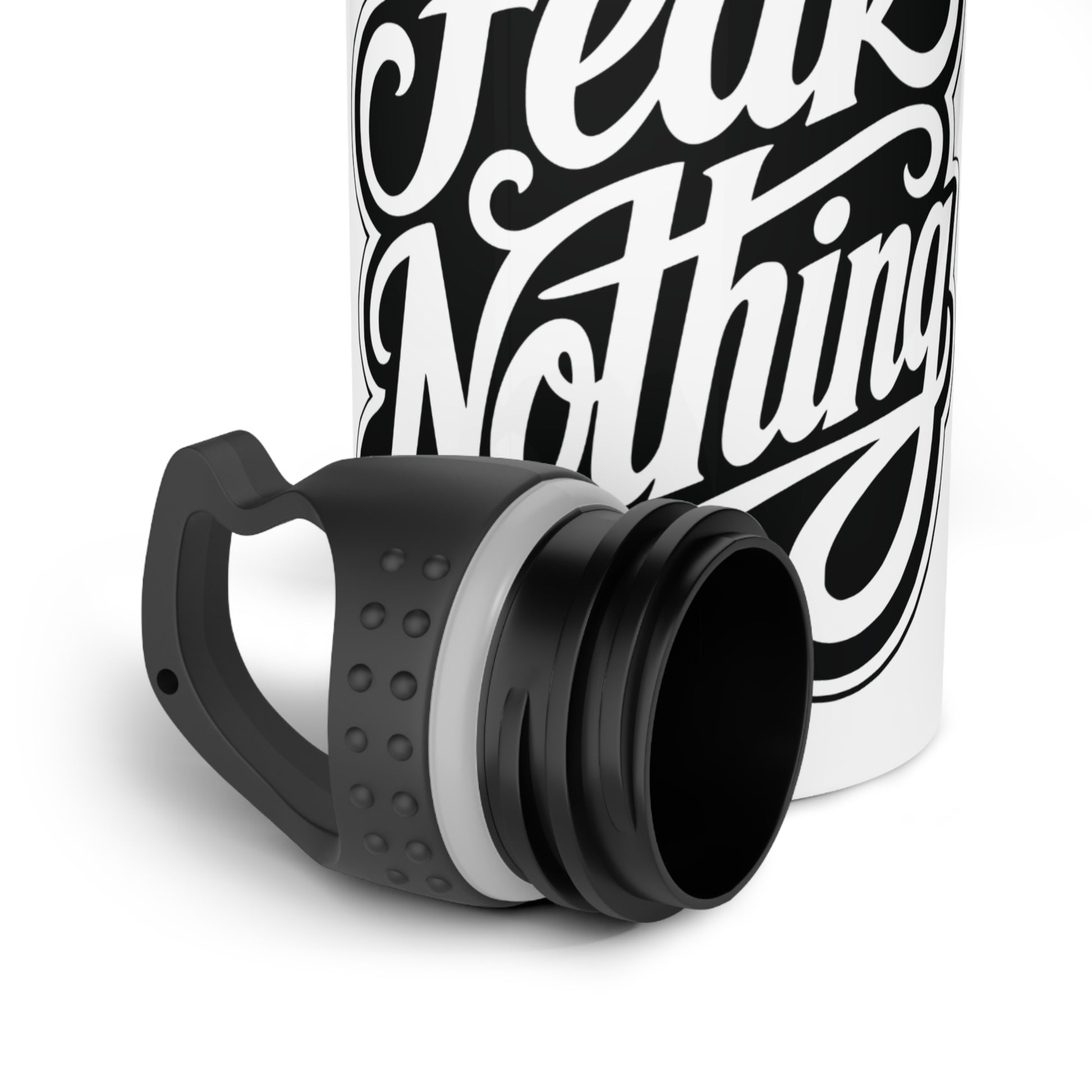 White bottle with black text "Fear Nothing" and a detached black lid.