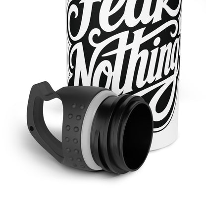 White bottle with black text "Fear Nothing" and a detached black lid.