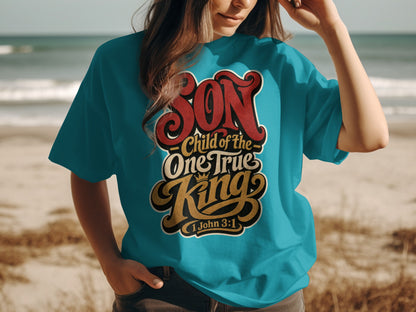 Turquoise t-shirt with "Son Child of the One True King 1 John 3:1" text.