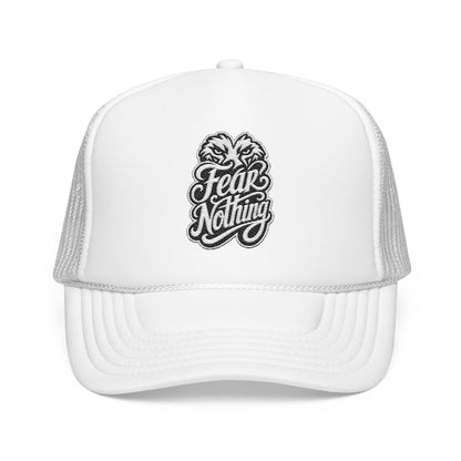 White trucker hat with embroidered "Fear Nothing" text and animalistic eyes graphic.