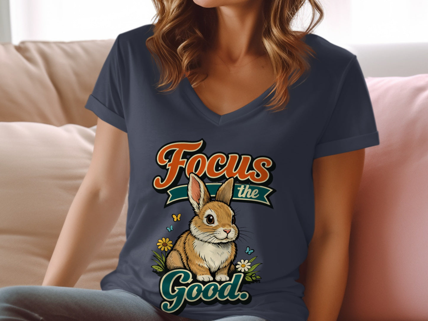 A rabbit sits among flowers, with text "Focus the Good."