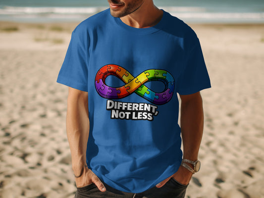 Blue t-shirt with rainbow infinity puzzle symbol and text "DIFFERENT, NOT LESS".