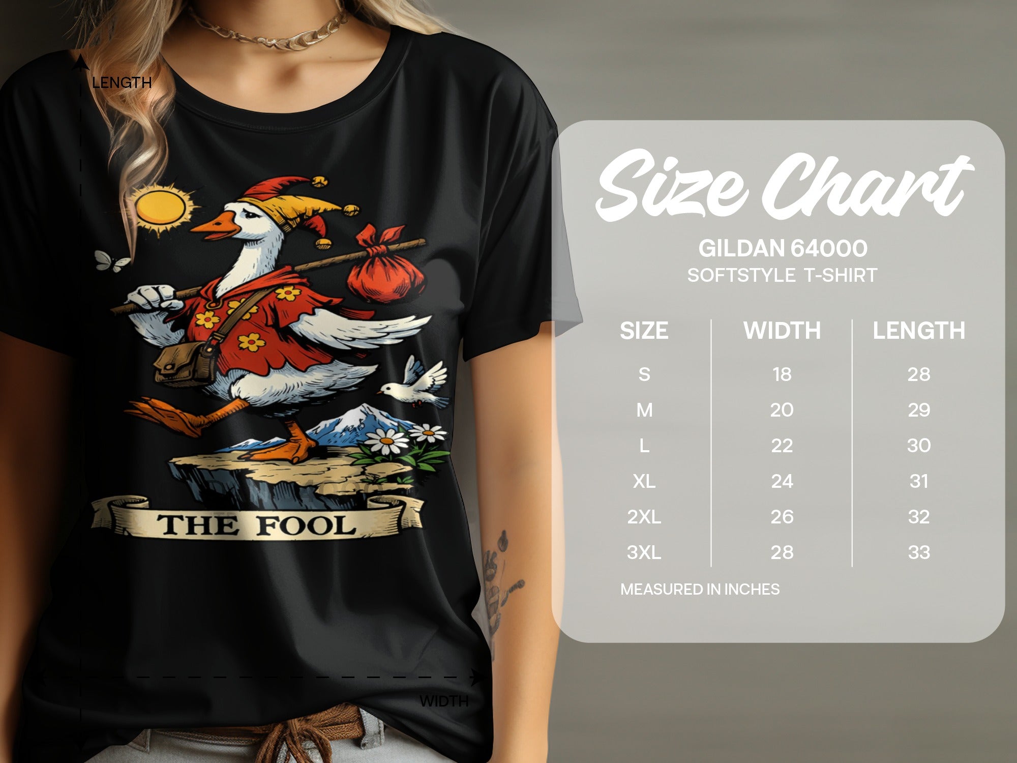 Black t-shirt with "The Fool" tarot card illustration and a Gildan 64000 size chart.