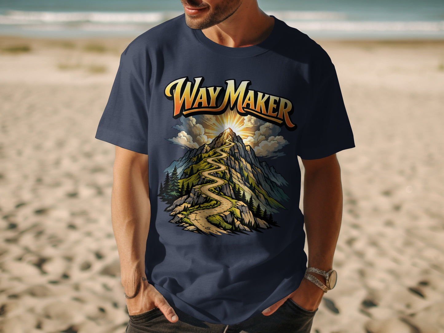 Navy t-shirt graphic with "Way Maker" text above a winding mountain path and sun.