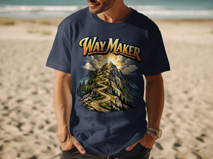 Navy t-shirt graphic with "Way Maker" text above a winding mountain path and sun.