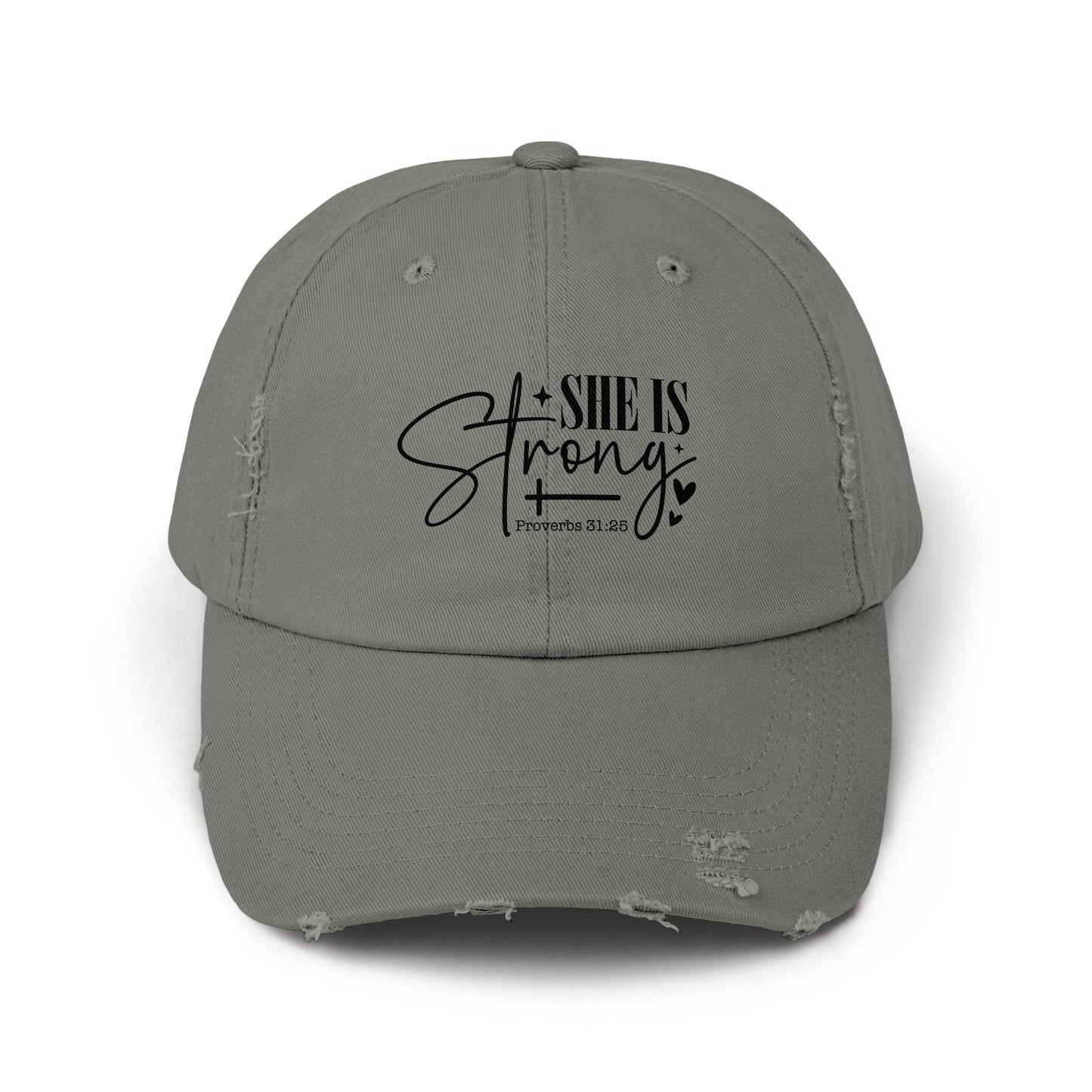 Distressed grey baseball cap with black text "SHE IS Strong" and "Proverbs 31:25".