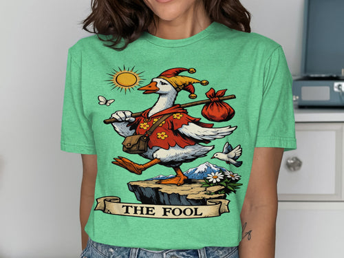 Goose in jester hat carrying a bag on a stick with "THE FOOL" banner.