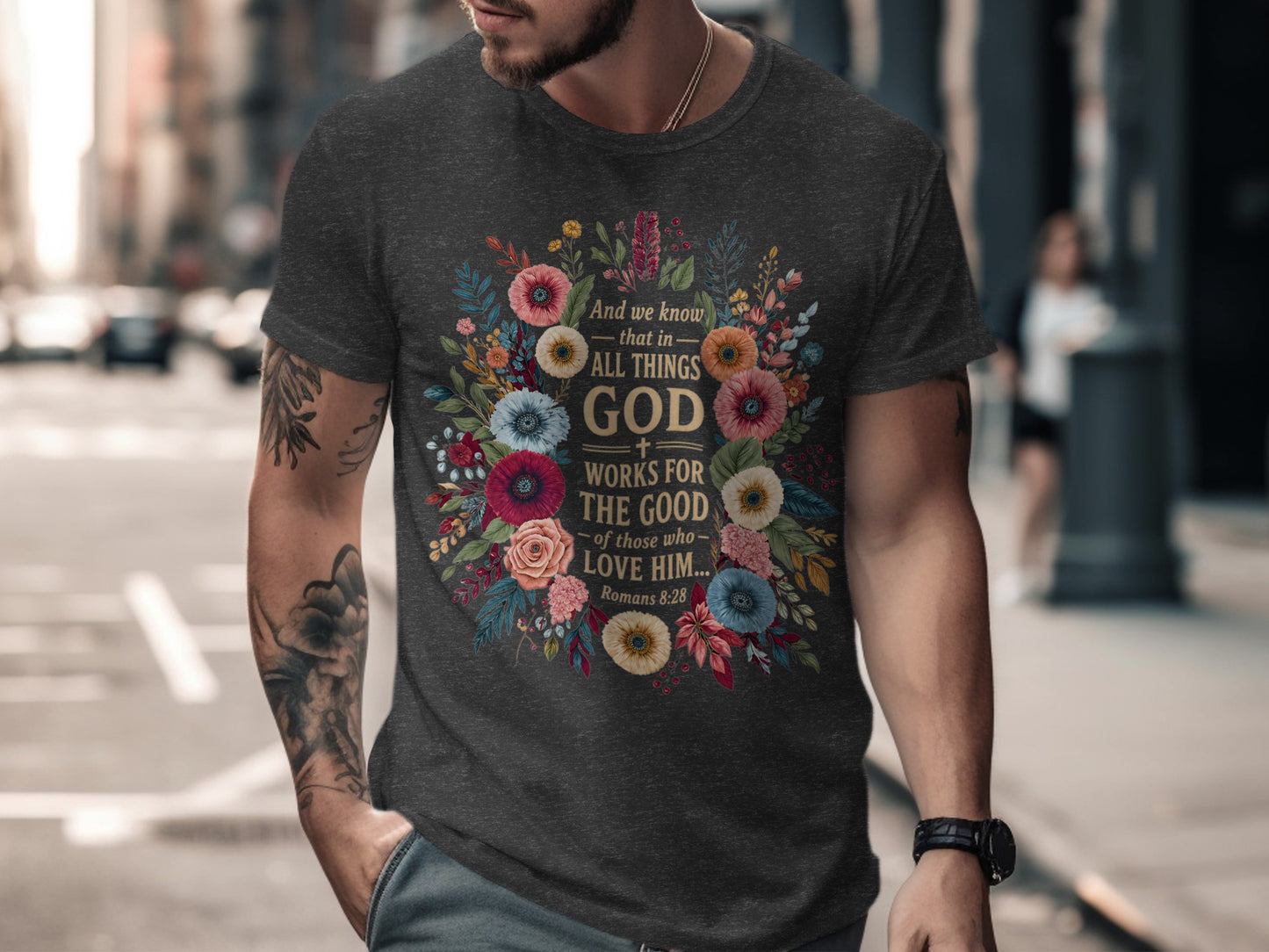 Dark grey t-shirt with floral design and "God Works For The Good" Bible verse.