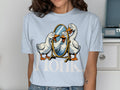 Three cartoon geese look into a mirror with text that reads "Honk."
