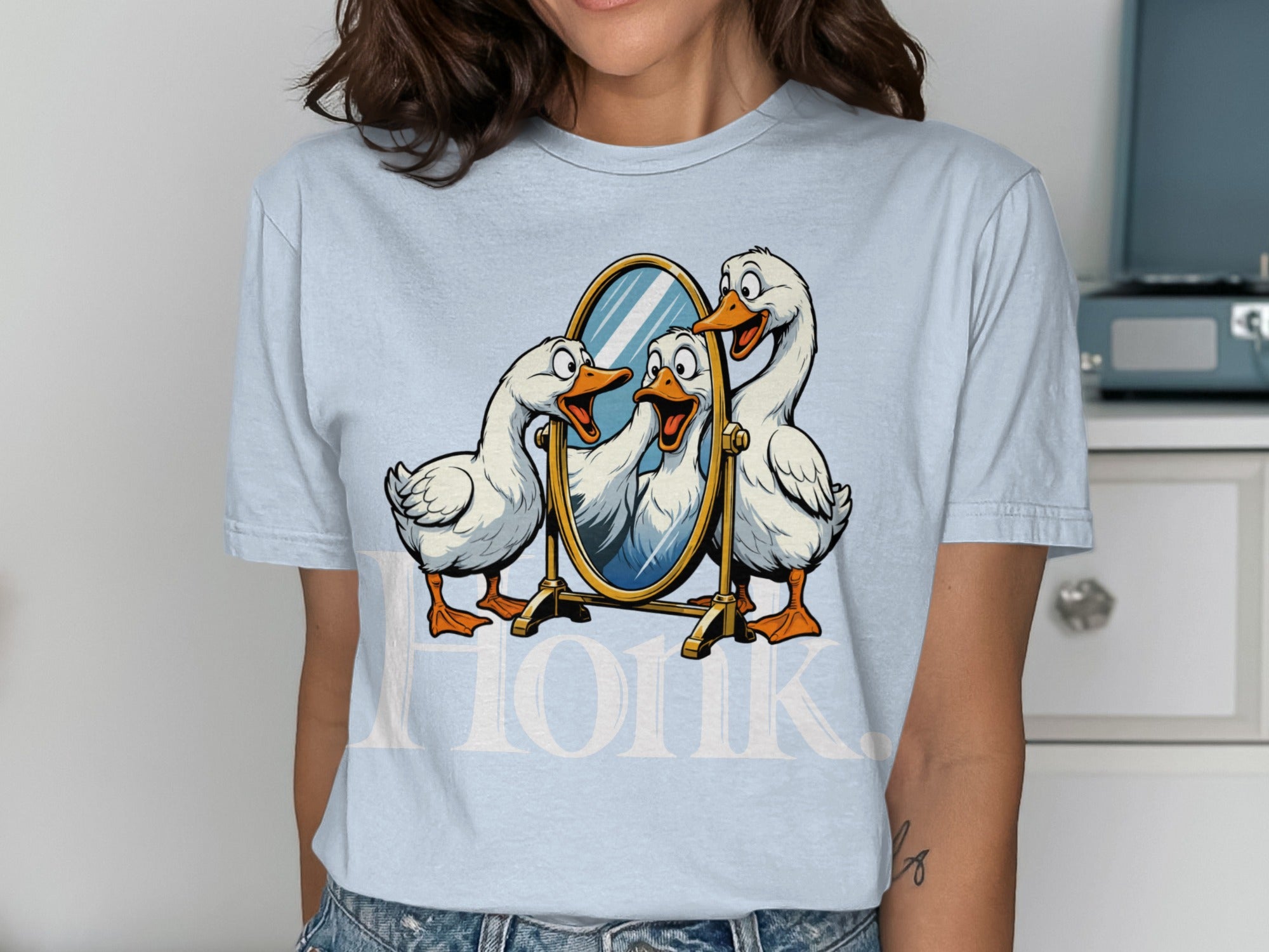 Three cartoon geese look into a mirror with text that reads "Honk."